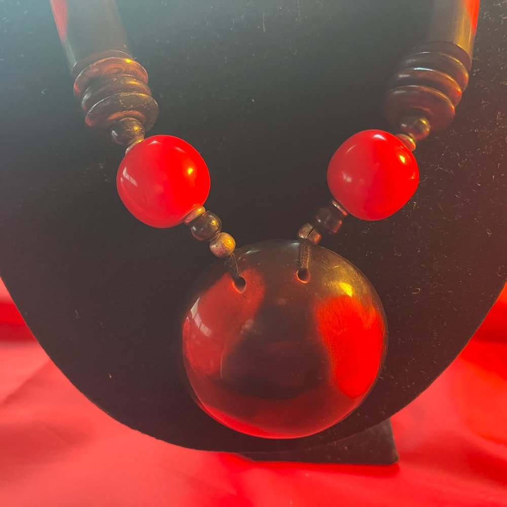 Vintage, substantial artsy necklace , black and red animal-type, great condition